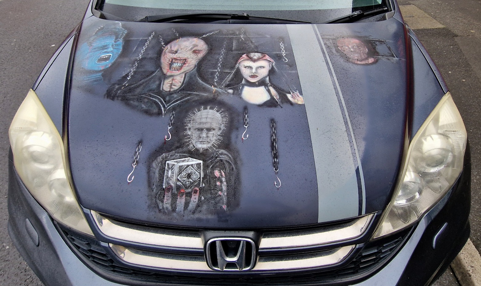 Car with characters from the Hellraiser movies on the bonnet